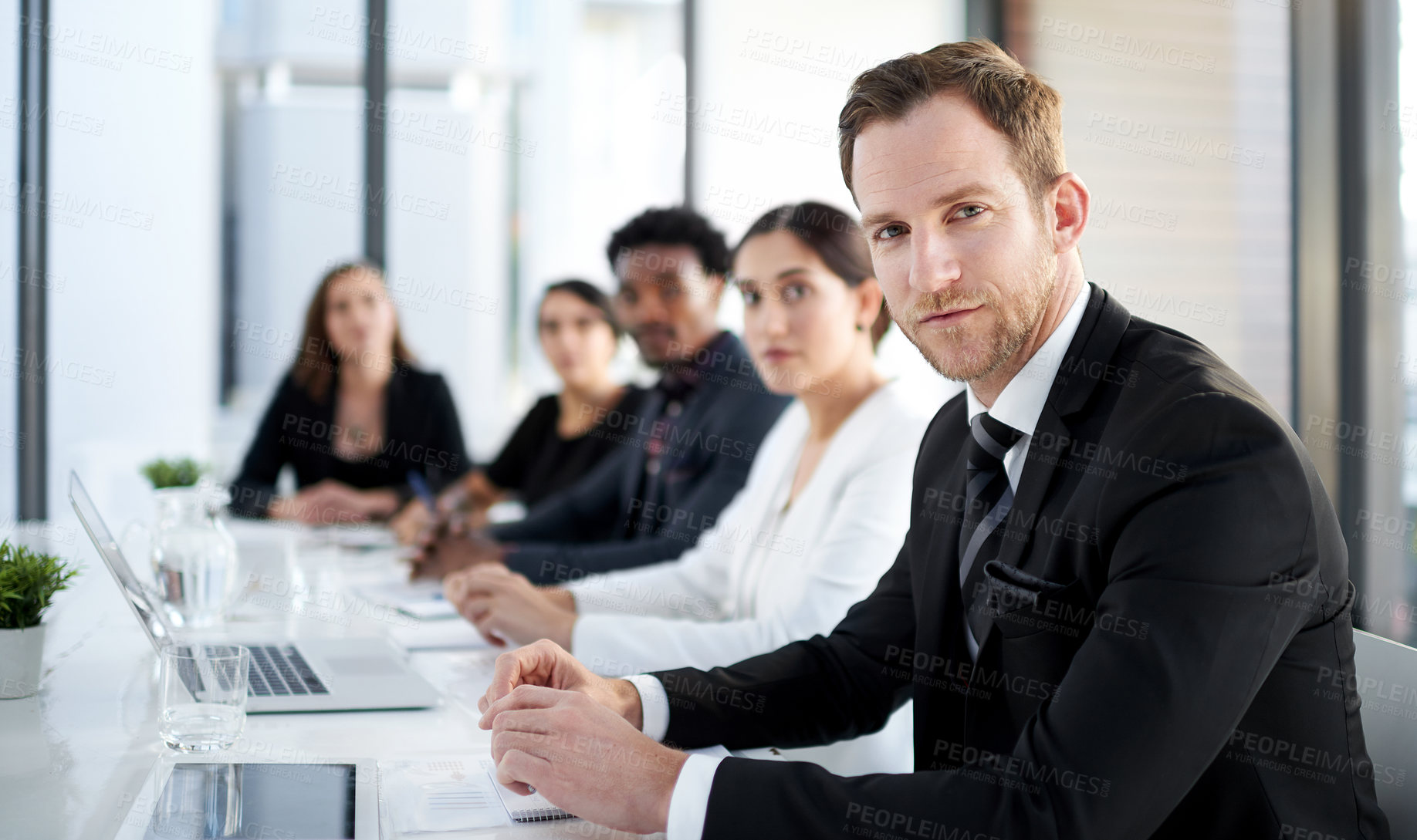 Buy stock photo Meeting, portrait and man with business people in conference room with confidence, tech or planning. Boardroom, men and women together in corporate workshop with laptop, b2b report or trust at office