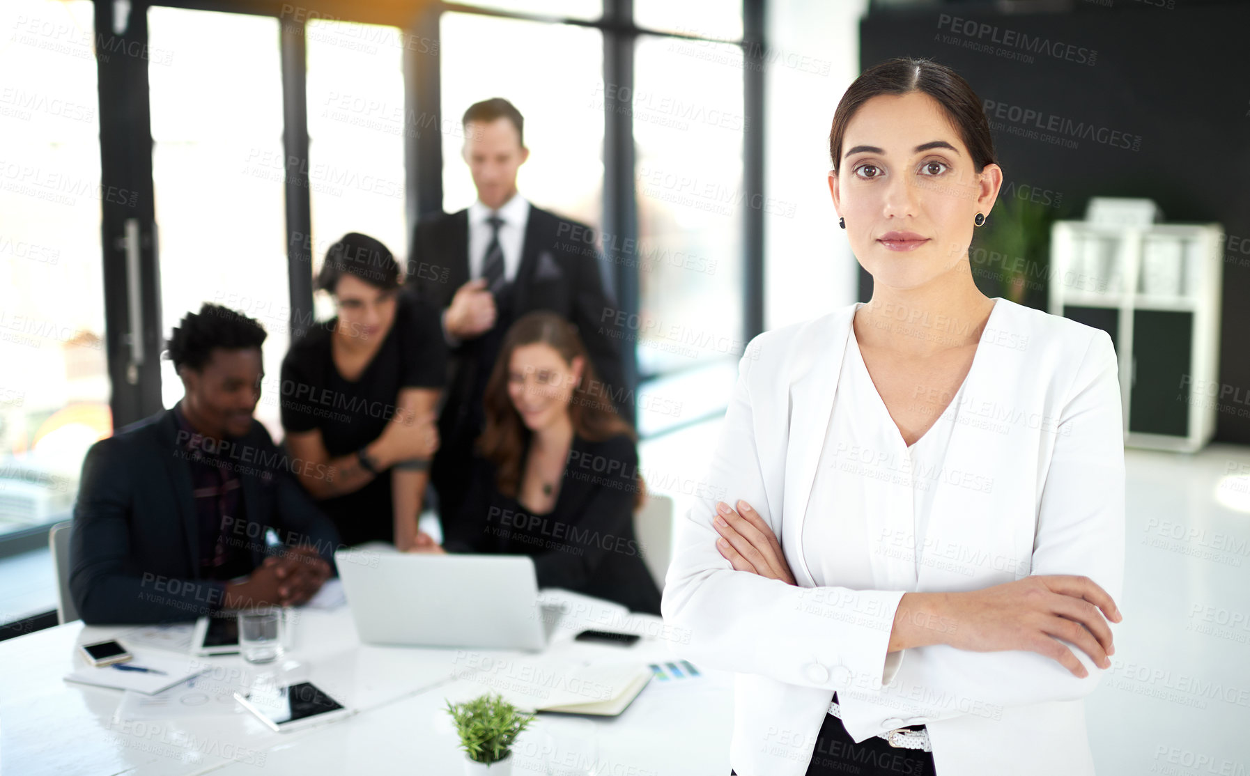 Buy stock photo Professional, portrait of businesswoman in meeting with confidence for leader or manager and team in office. Pride, smile and woman with business people, collaboration and work on startup project