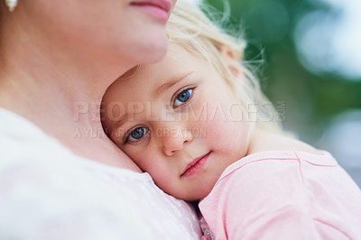 Buy stock photo Portait of a sad little girl being comforted by her mother outside