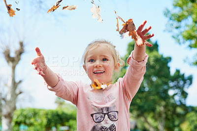 Buy stock photo Autumn, leaves and girl play with freedom outdoor and relax on Thanksgiving, holiday or vacation. Happy, child and games in backyard playground, park and hands with leaf from trees in garden or woods