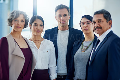 Buy stock photo Cropped portrait of a diverse group of businesspeople standing together in their office