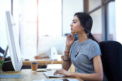 Buy stock photo Indian woman, online and internet on computer in office with elections research and information by desk on break. Professional, employee and typing on tech pc at workplace for intern project planning
