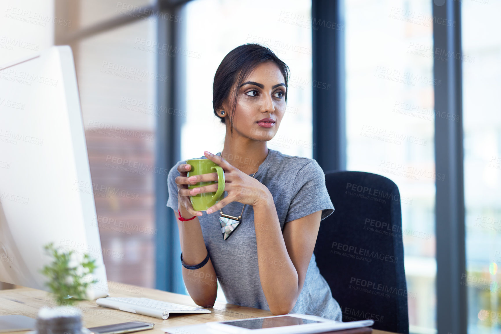 Buy stock photo Business, computer and Indian woman thinking in office with coffee, questions and solution, planning or reflection. Daydreaming, tea cup and gen z girl app designer with idea, insight or inspiration