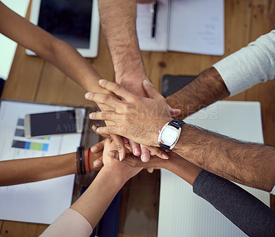 Buy stock photo Cropped shot of a group of colleagues joining their hands together in agreement