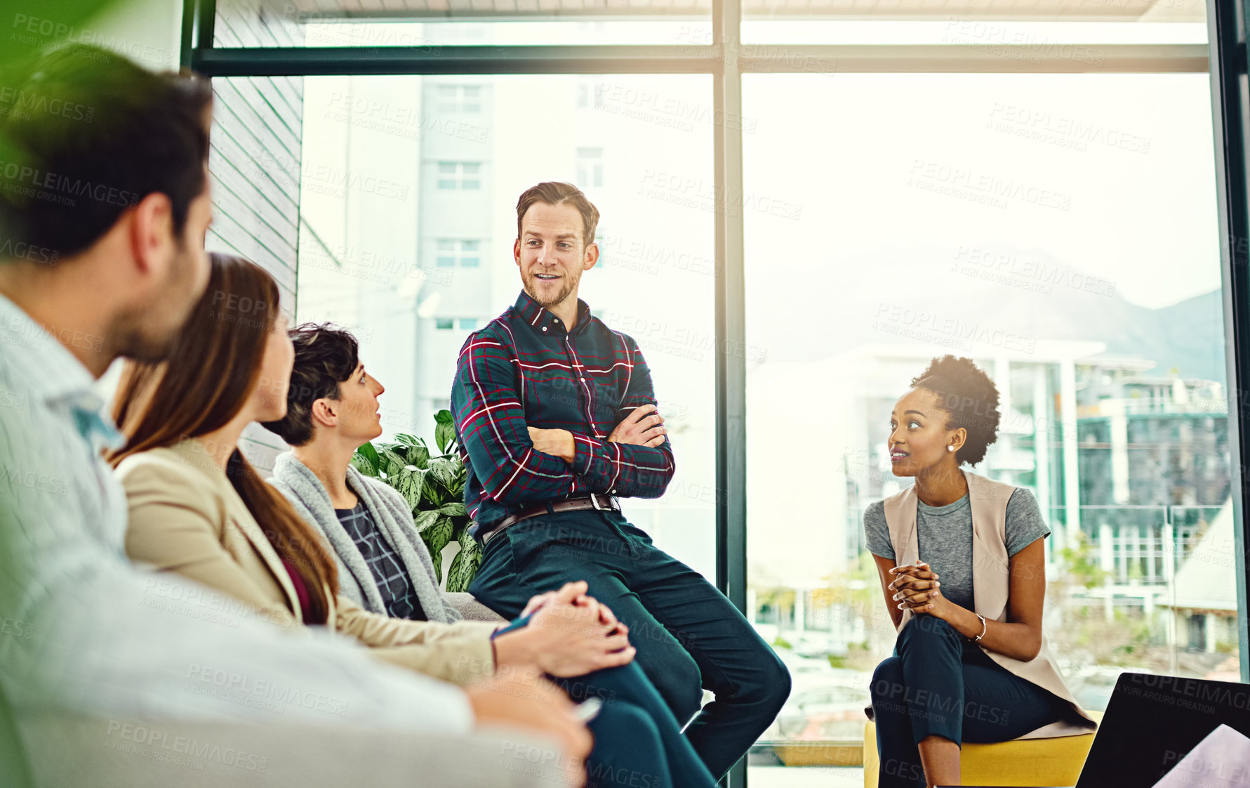 Buy stock photo Cropped shot of a group of colleagues having a discussion in an office