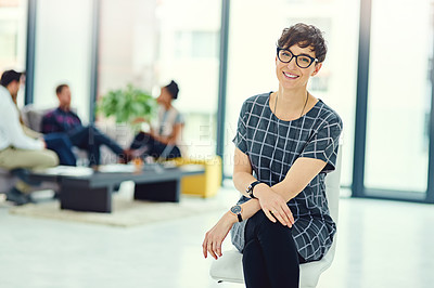 Buy stock photo Portrait, woman and sitting with confidence in modern office for startup company, collaboration and design. Female entrepreneur, pride and smile for small business with creative job and team