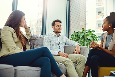 Buy stock photo Cropped shot of a group of colleagues having a discussion in an office