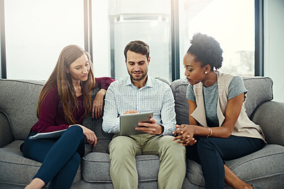 Buy stock photo Collaboration, discussion and employee with tablet on sofa for information, teamwork and conversation in office. Planning, ideas and workers with touchscreen or technology for startup project