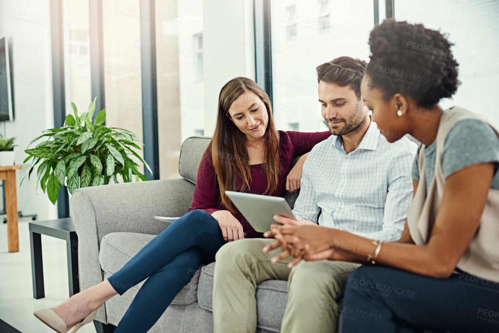 Buy stock photo Teamwork, discussion and employee with tablet on sofa for information, collaboration and conversation in office. Planning, ideas and workers with touchscreen or technology for startup project