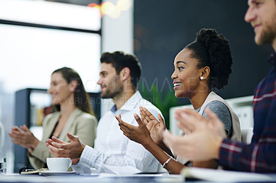 Buy stock photo Cropped shot of a group of businesspeople applauding together in a boardroom meeting