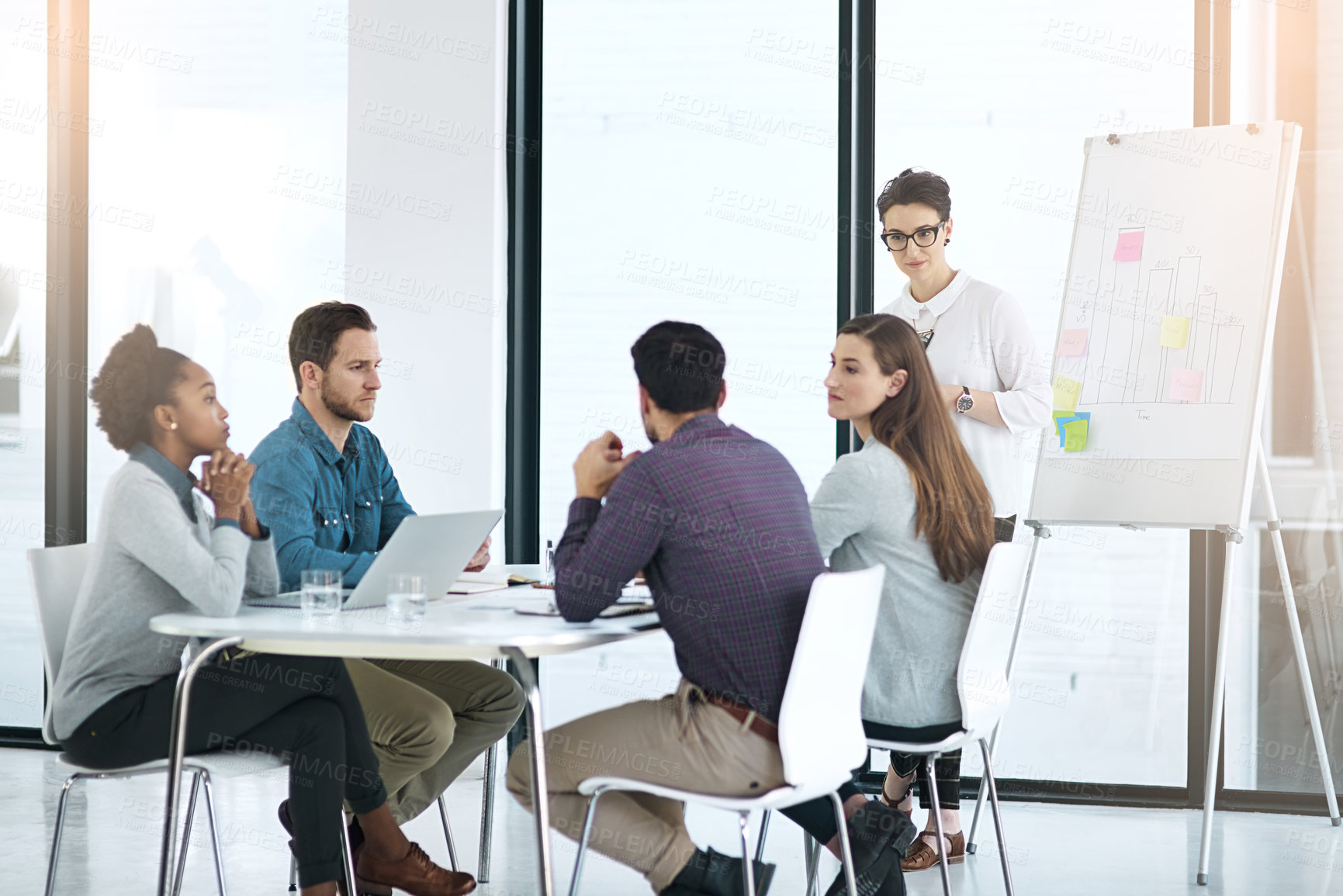 Buy stock photo Meeting, business people and whiteboard in office for brainstorming, strategy and planning project. Collaboration, diversity and employees for discussion, ideas or teamwork at startup with lens flare