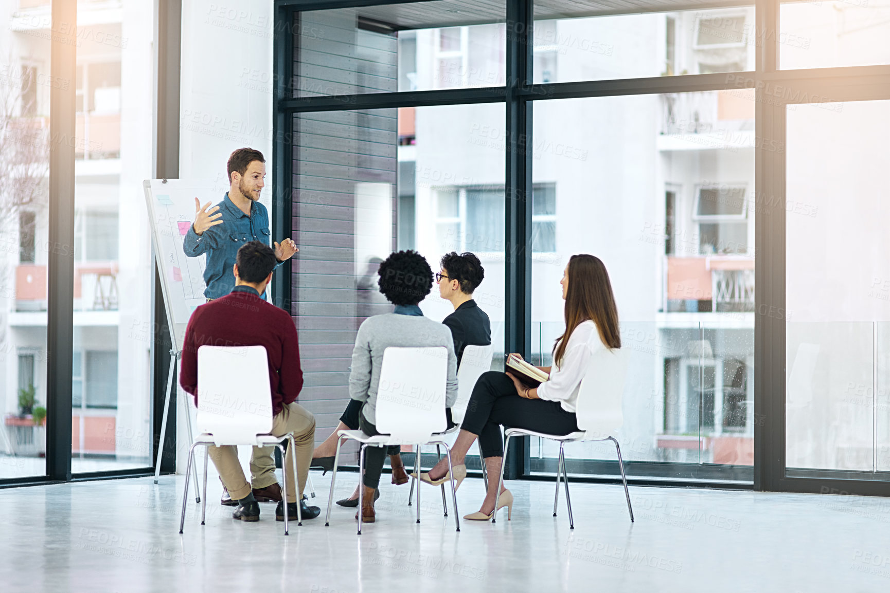 Buy stock photo Presentation, meeting and business people with whiteboard in office for brainstorming, strategy and planning project. Lens flare, diversity and employees for discussion, ideas or teamwork at startup