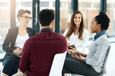 Buy stock photo Cropped shot of a group of colleagues having a meeting together in an office