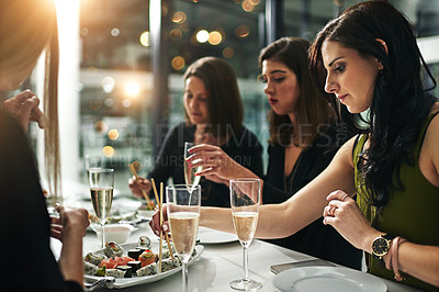 Buy stock photo Women friends, dinner and restaurant with champagne, sushi or toast in bonding, happiness or celebration. Woman group, food and party for fine dining, friendship or conversation in night to celebrate