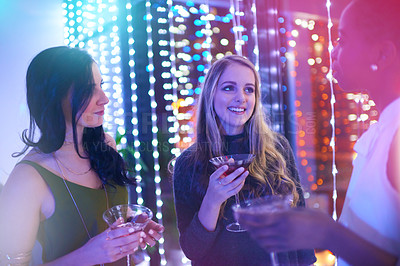 Buy stock photo Women, friends and cocktail for talk in nightclub, event and happy hour with smile for memory. People, nightclub and drink with diversity, alcohol or celebration with social chat at new years party