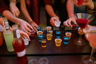 Buy stock photo Alcohol, friends and hands at party in pub for birthday, friendship and celebration in restaurant. Fun, colleagues and bonding over drinks in bistro or bar for entertainment, relaxing and happy hour
