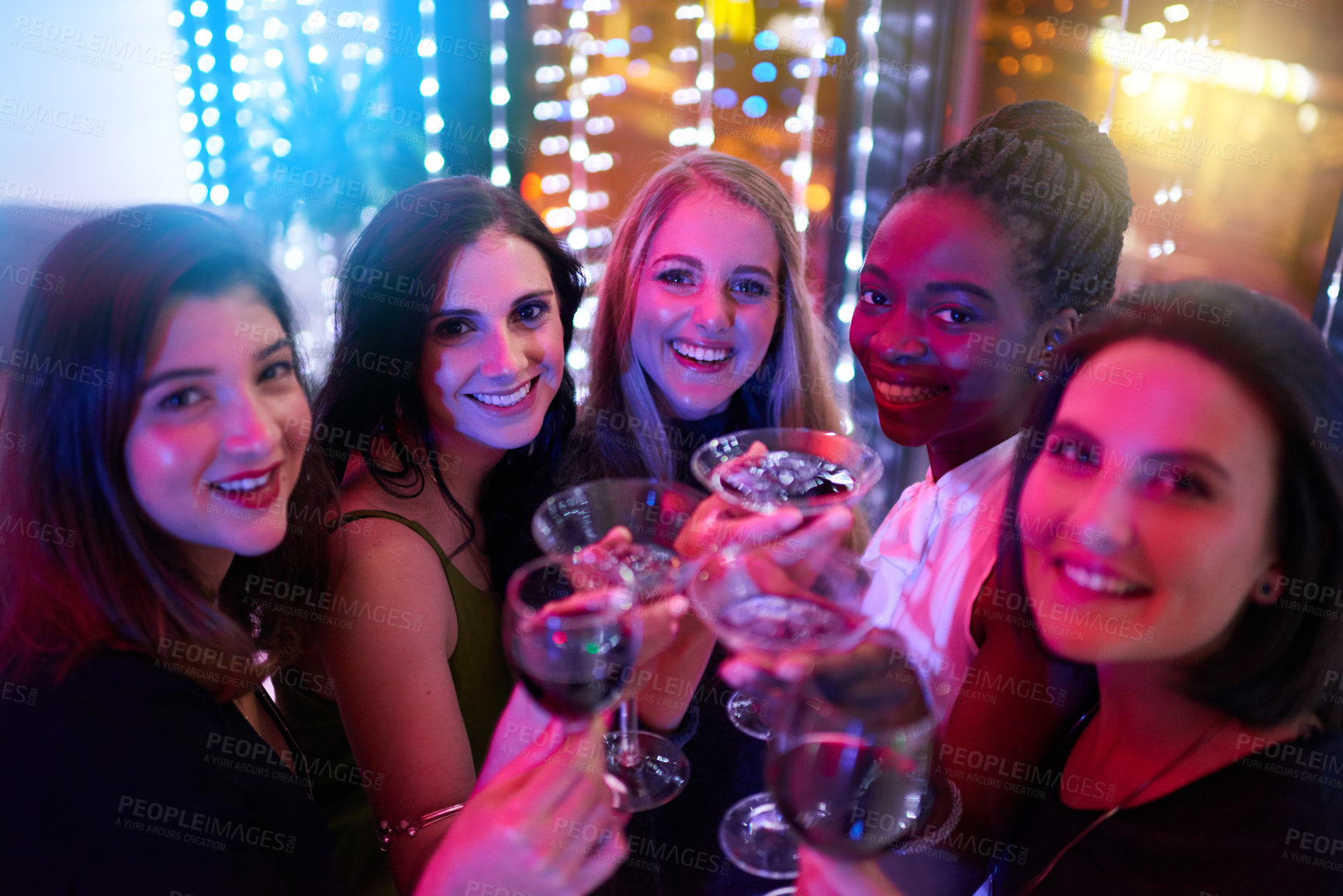 Buy stock photo Portrait of a group of young women drinking cocktails at a party