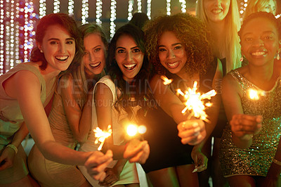 Buy stock photo Portrait, party and people with sparklers, celebration and excited with happiness, cheerful and achievement. Fireworks, group or event with joy, birthday or social gathering with diversity or holiday