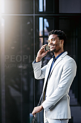 Buy stock photo Cropped shot of a young businessman using his cellphone on the office balcony
