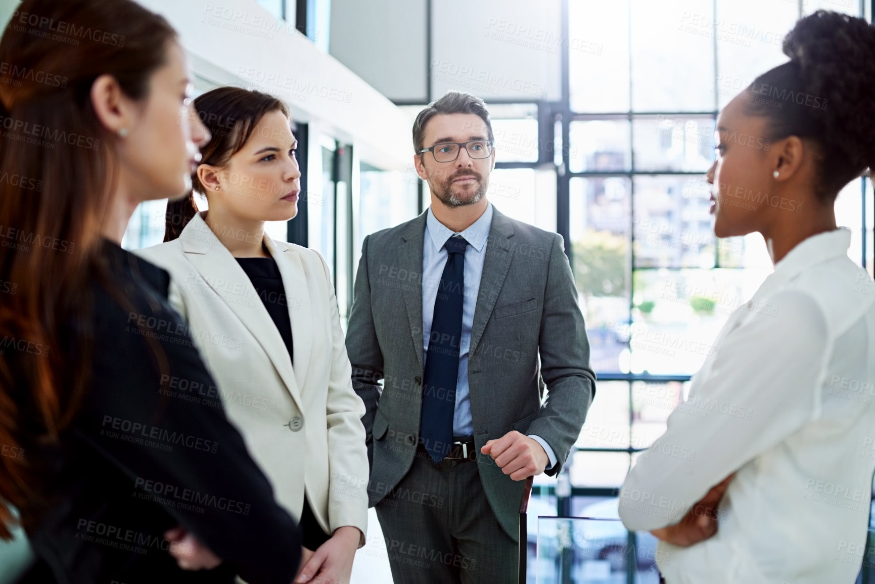 Buy stock photo Serious, conversation and business people in meeting, communication and discussion in modern office. Manager, staff and group in workplace, planning and checking with feedback, review and failure