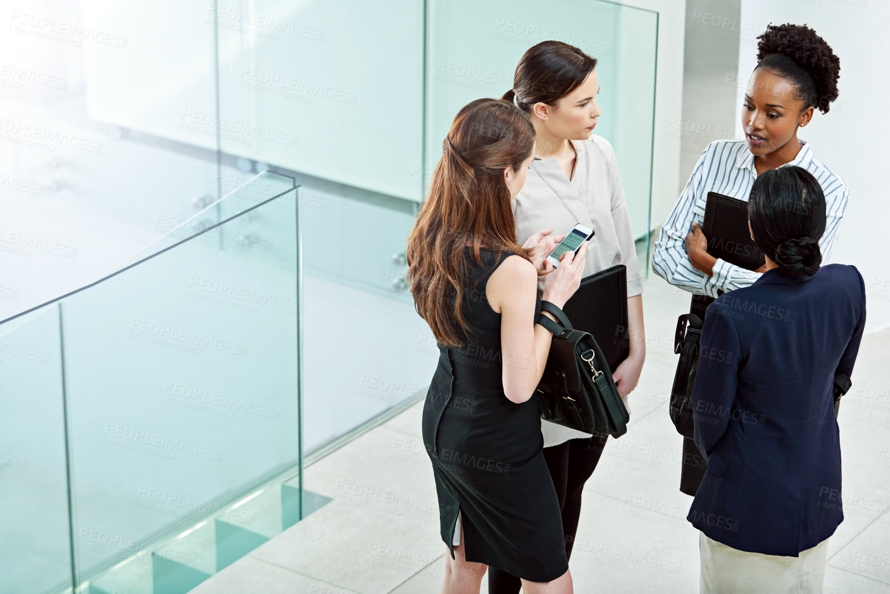Buy stock photo Business people, planning and talking together in lobby, teamwork and women for conversation. Employees, high angle and speaking on company growth, communication and support or collaboration on idea