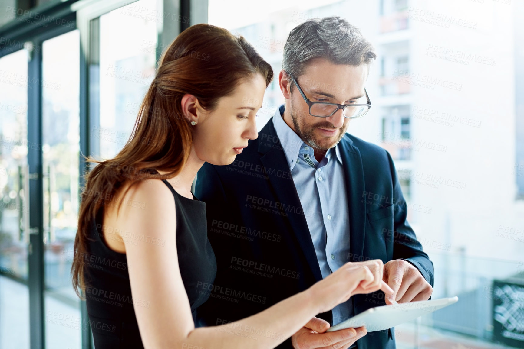 Buy stock photo Office, training and business people with tablet for mature man or ceo and female employee for discussion. Tech, communication and intern with mentor for coaching, learning and journalism internship 