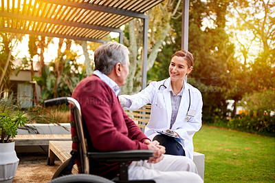 Buy stock photo Shot of a young doctor and her elderly patient talking while sitting outside