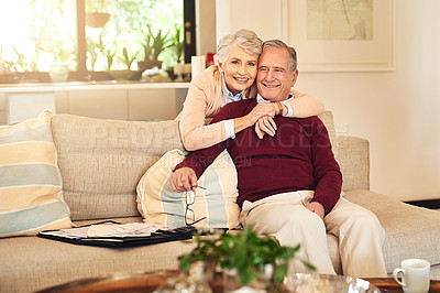 Buy stock photo Hug, love and portrait with senior couple on sofa in living room of retirement home together for bonding. Happy, relax or smile with old man and woman in apartment for commitment, marriage or weekend