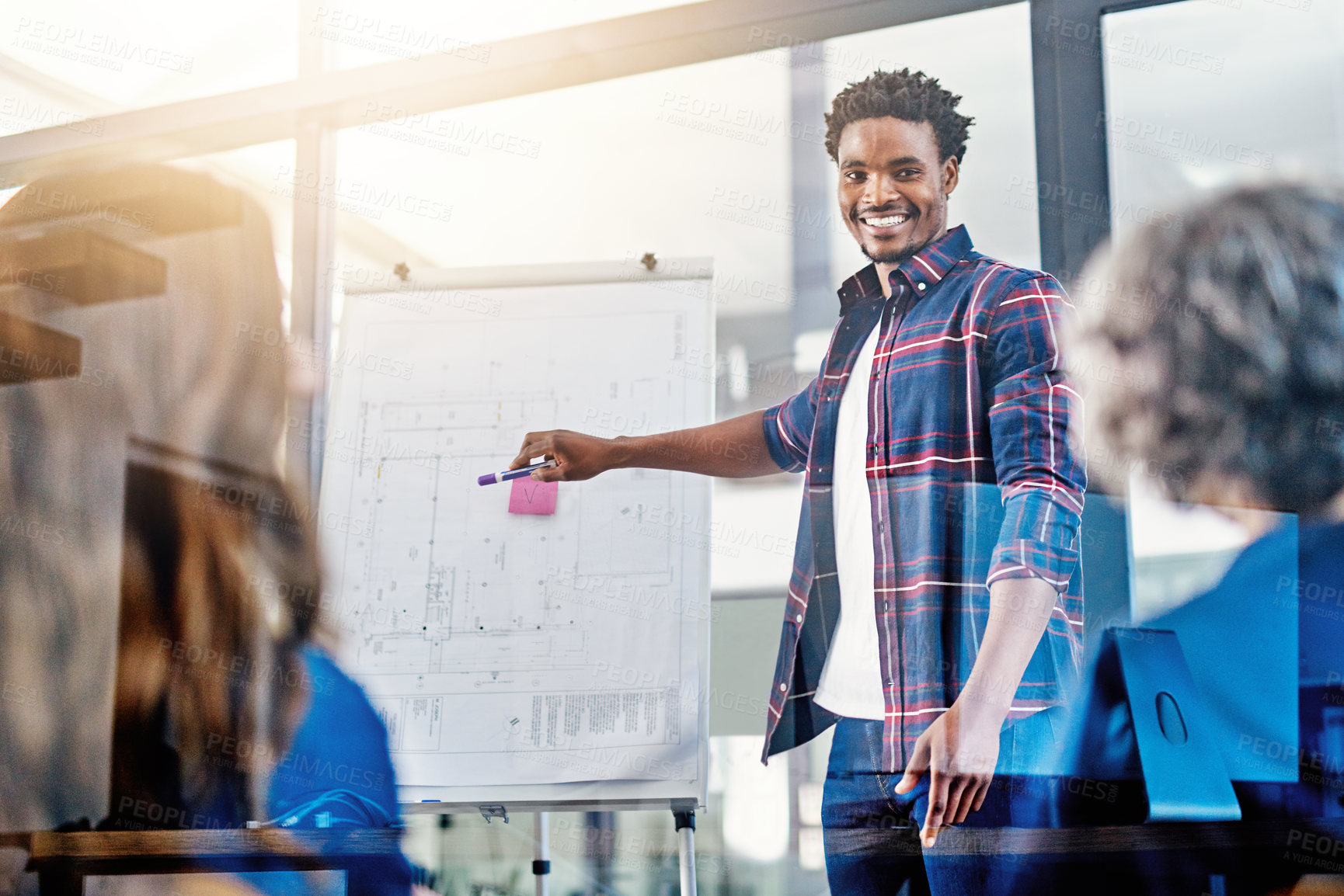 Buy stock photo Business meeting, presentation and happy black man with team in office for growth, development and sale target. Speaker, black man and leader with whiteboard and people for planning, goal or strategy