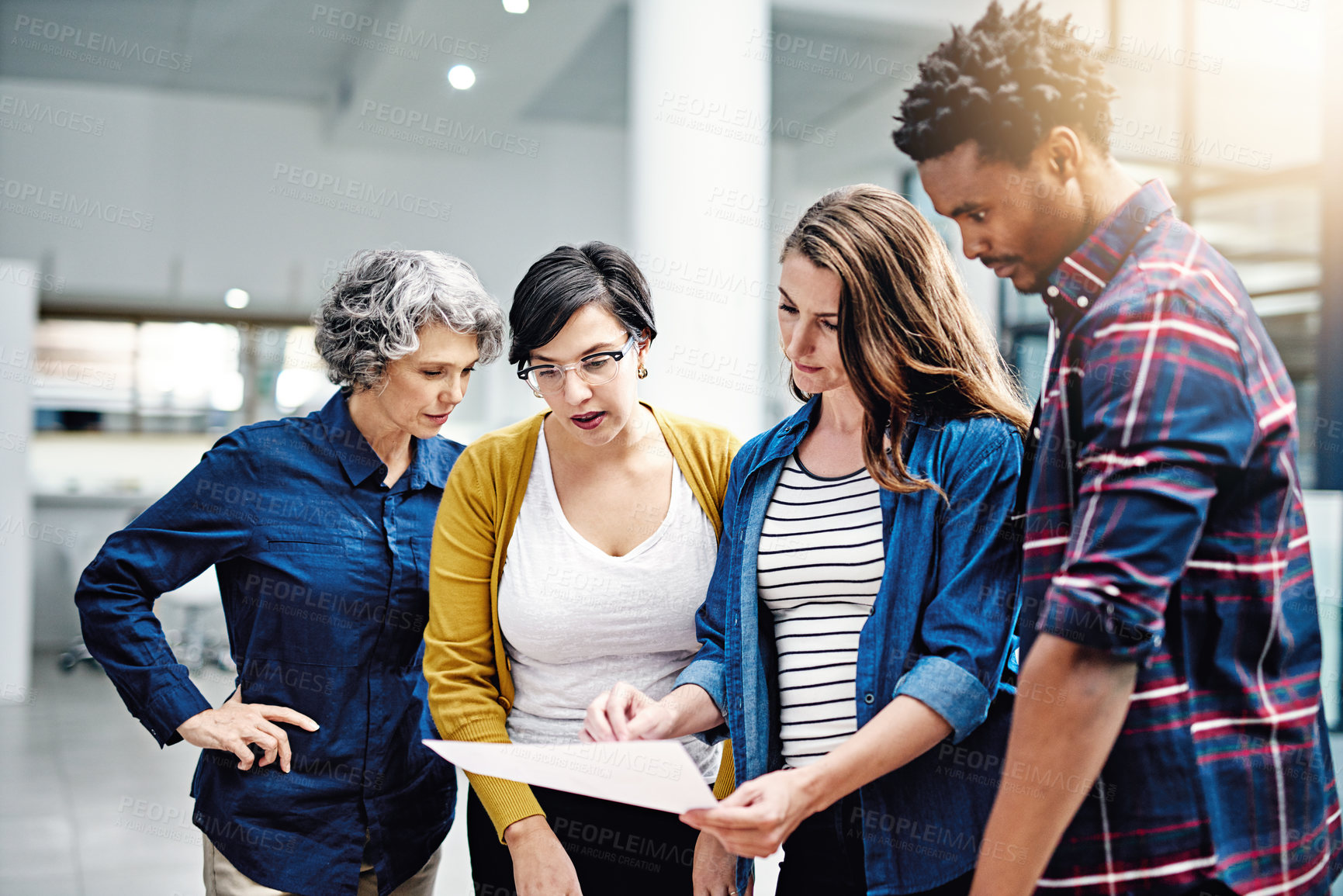 Buy stock photo Document, diversity and designer team planning or brainstorming strategy in collaboration together at a startup. Company, growth and business analyst meeting of group of employees working in teamwork