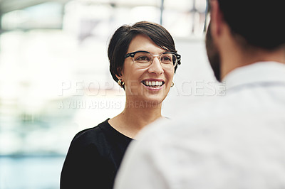 Buy stock photo Cropped shot of a businesswoman having a discussion with a colleague in an office