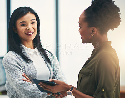 Buy stock photo Portrait of young creative having a discussion with a colleague in an office