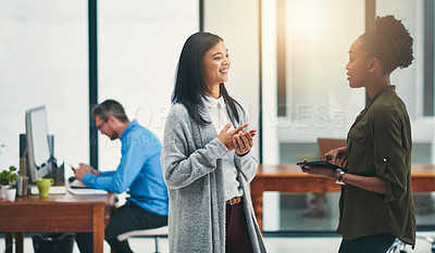 Buy stock photo Cropped shot of young creatives having a discussion in an office