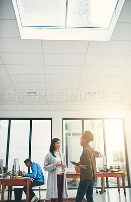 Buy stock photo Cropped shot of young creatives having a discussion in an office