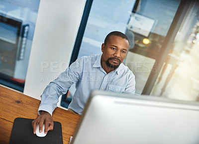 Buy stock photo Cropped shot of a businessman working on his computer in the office