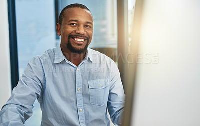 Buy stock photo Cropped portrait of a businessman working on his computer in the office
