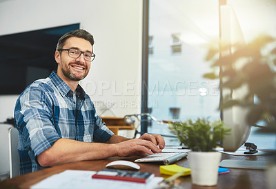 Buy stock photo Cropped portrait of a businessman working on his computer in the office