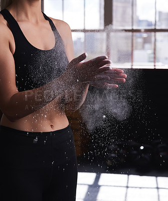 Buy stock photo Cropped shot of a woman powdering her hands at the gym