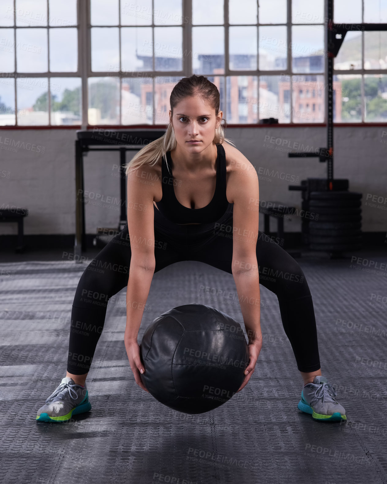 Buy stock photo Woman, portrait and medicine ball in gym for workout, wellness and fitness with energy. Female athlete, serious and sandbag in sports arena for exercise, health and training for body growth or goal