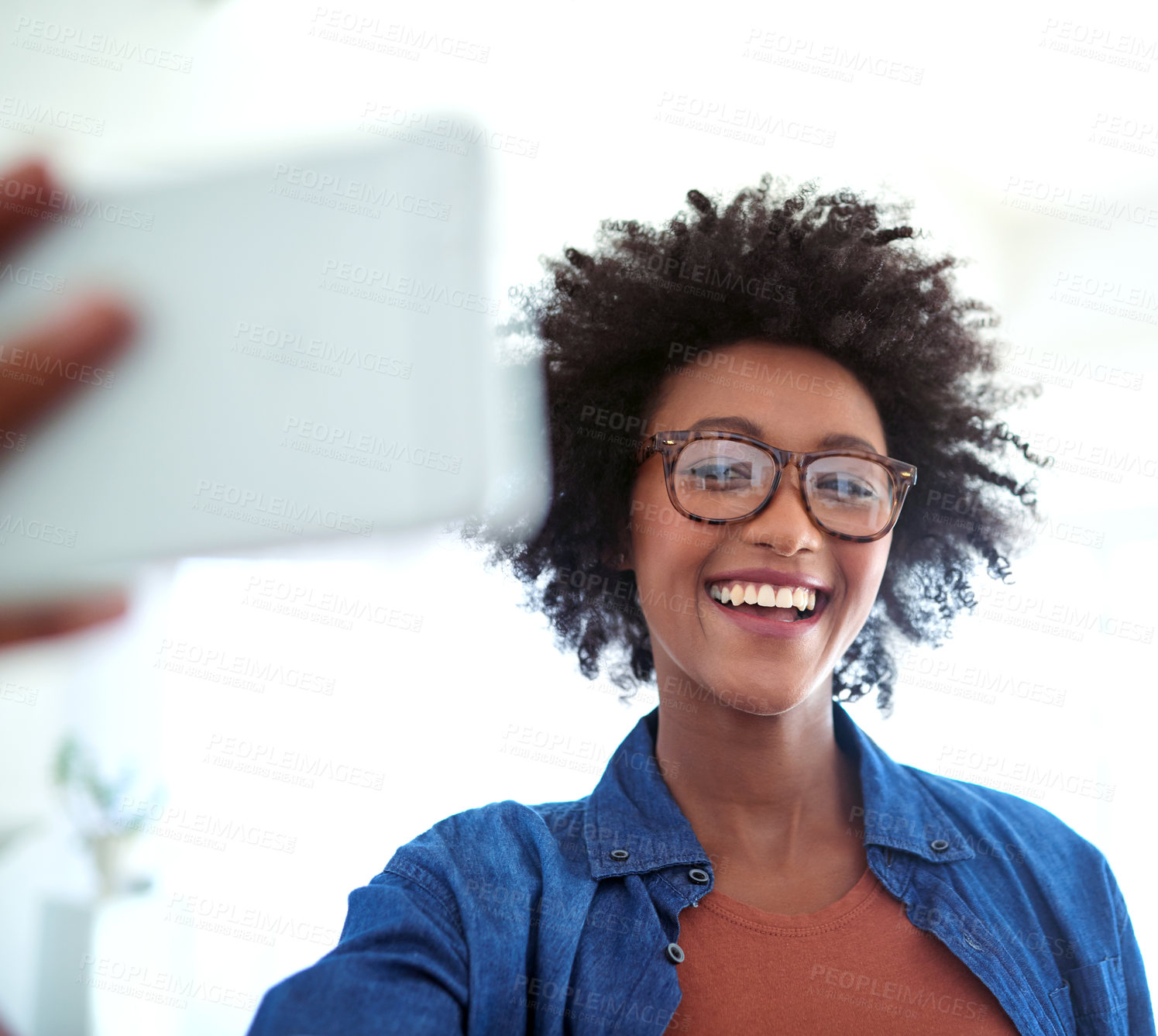 Buy stock photo Shot of an attractive young woman taking a selfie at home