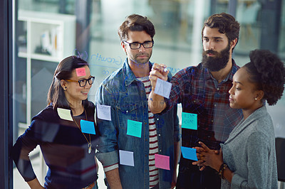 Buy stock photo Creative, glass wall and business people in meeting with teamwork in office for planning or brainstorming. Collaboration, sticky notes and group of copywriters working on project with discussion.