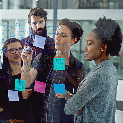 Buy stock photo Planning, glass wall and business people in meeting with collaboration in office for brainstorming project. Sticky notes, diversity and group of copywriters working on creative board with discussion.
