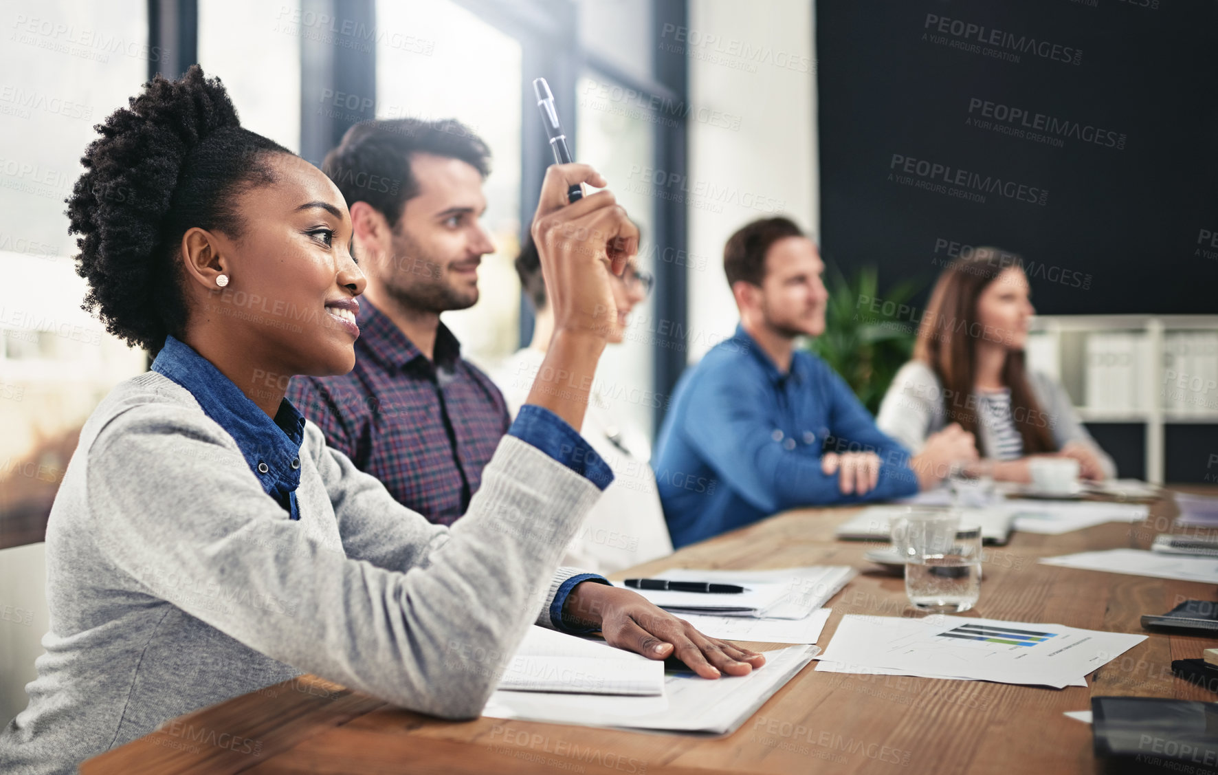 Buy stock photo Black woman, team diversity and raising hand for question in boardroom, office and workspace for faq. Businesspeople, meeting and query or point for finances with smile, notebook and collaboration