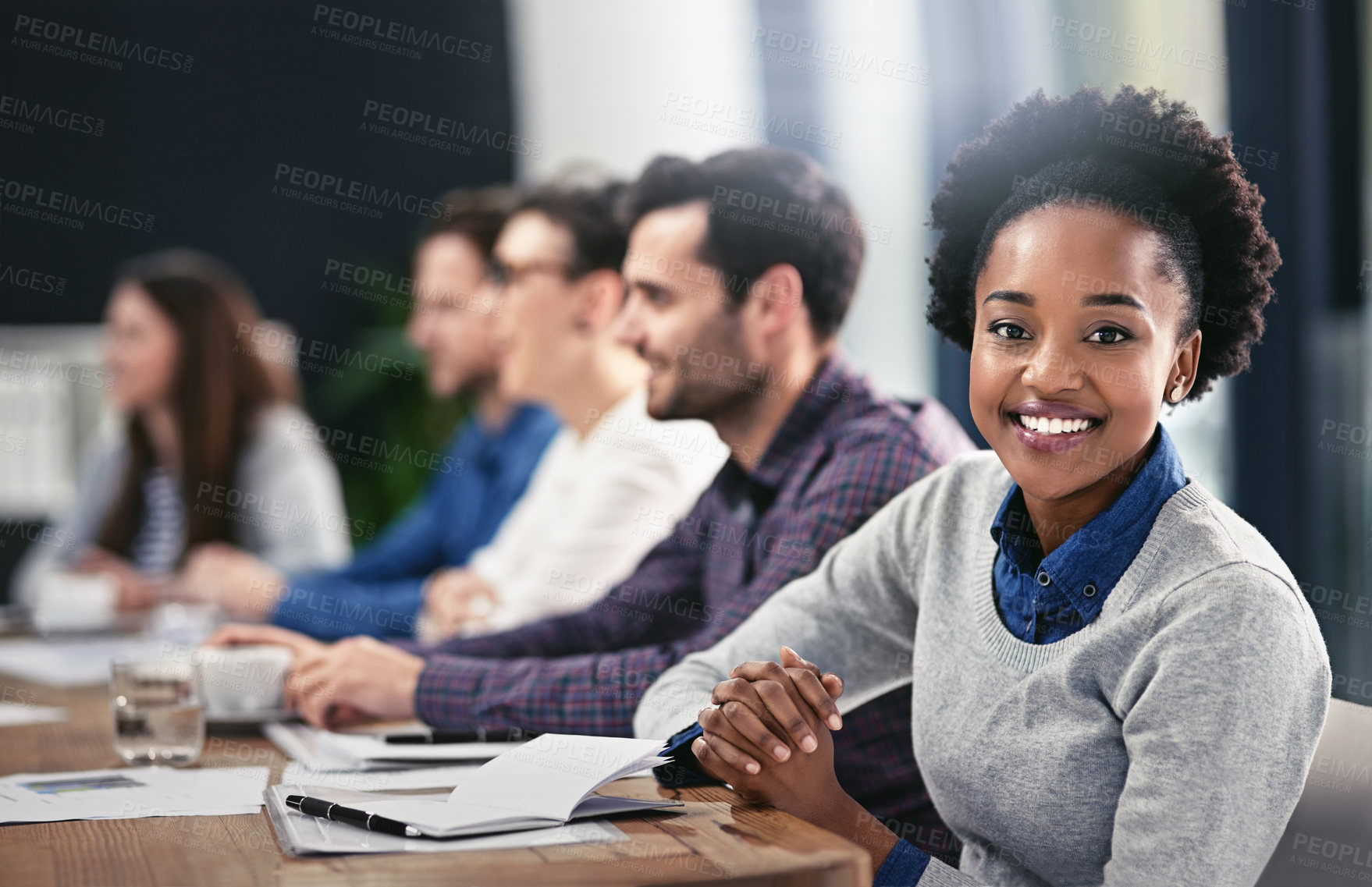 Buy stock photo Cropped portrait of a young businesswoman sitting in the boardroom during a meeting