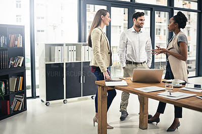 Buy stock photo Shot of a group of businesspeople having a discussion in the office