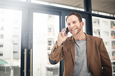 Buy stock photo Cropped shot of a businessman talking on his cellphone at the office