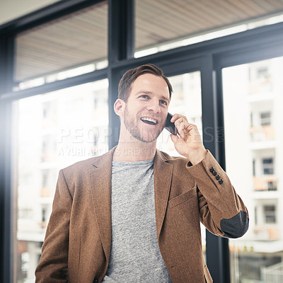 Buy stock photo Cropped shot of a businessman talking on his cellphone at the office