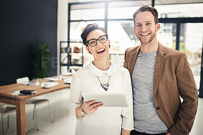 Buy stock photo Portrait of two businesspeople using a digital tablet