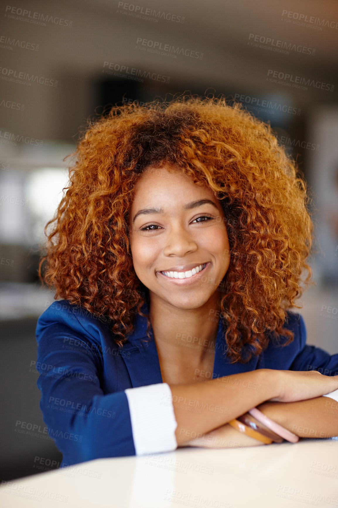 Buy stock photo Portrait of a confident young businesswoman standing in an office