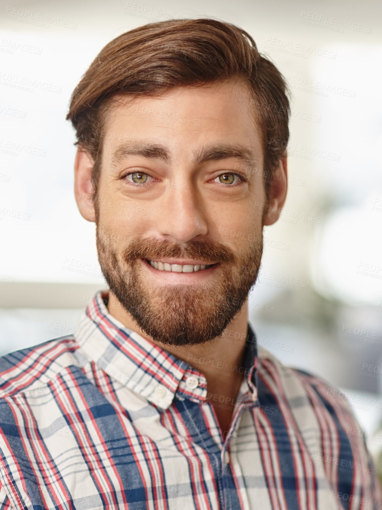 Buy stock photo Portrait of a confident young businessman standing in an office